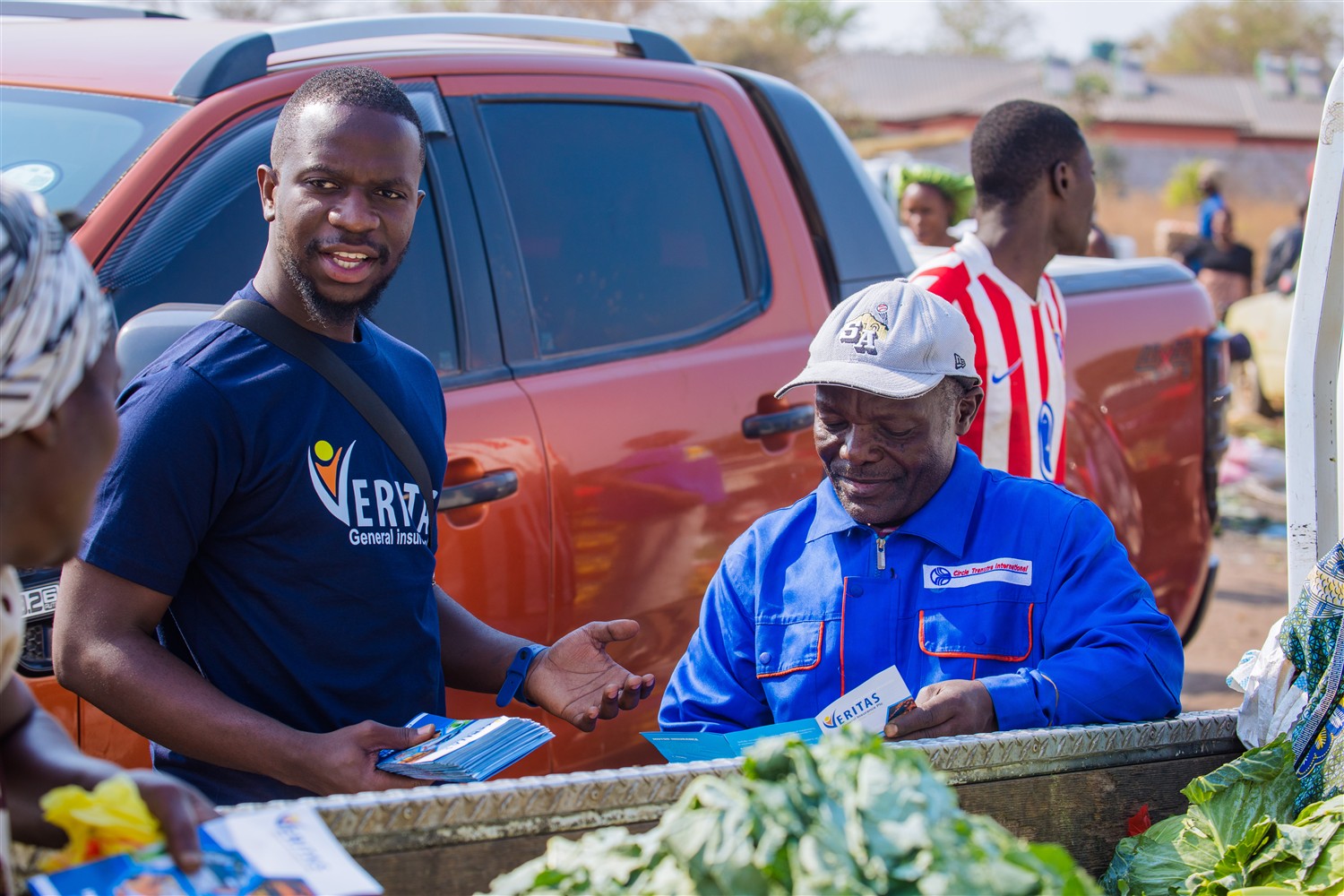 Veritas sharing insurance information with a member of the community